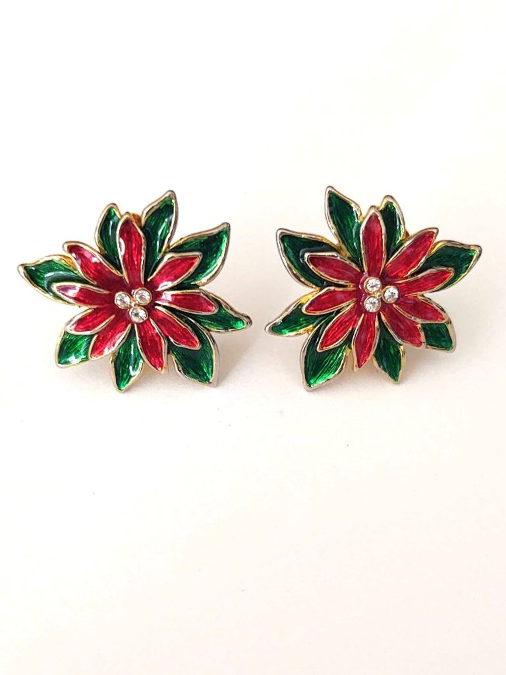 Vintage Poinsettia red and green enamel clip on earrings with cz accents